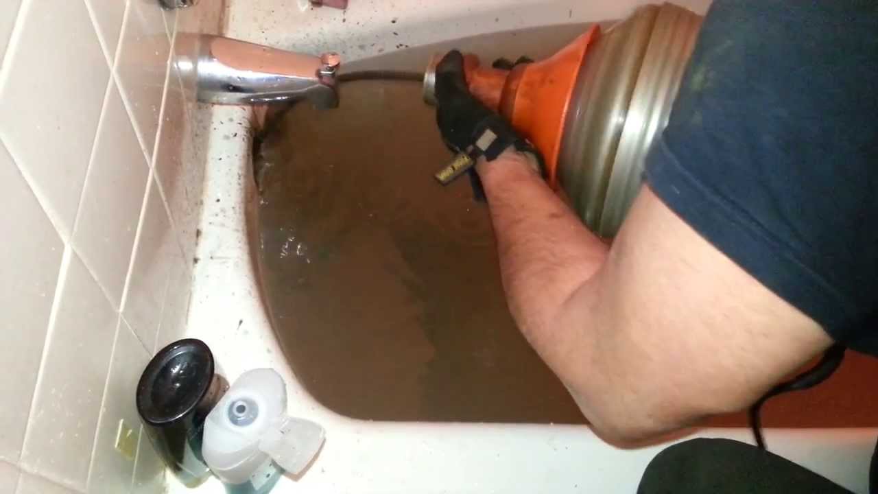 How To Snake Out Clogged Bathtub, How To Unclog A Bathtub Drain Full Of Water